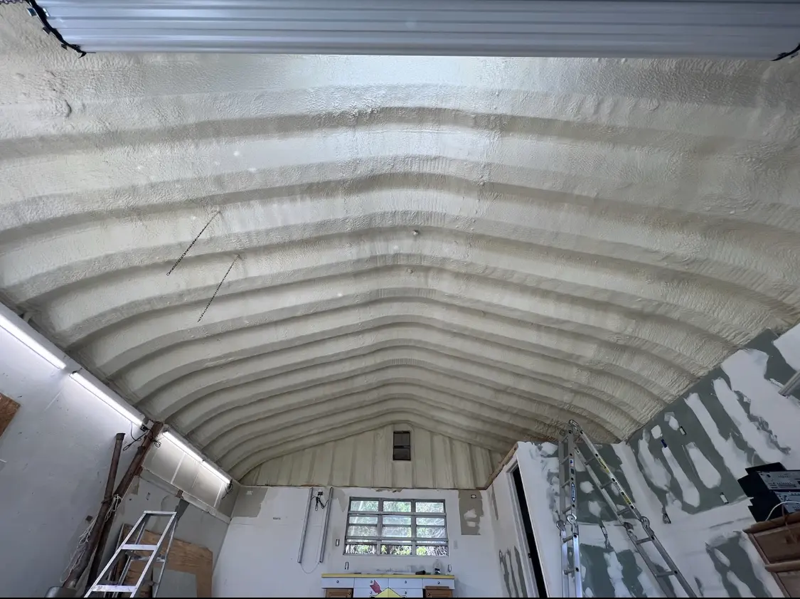 Spray polyurethane foam applied to the underside of a metal roof deck in East Highland Park